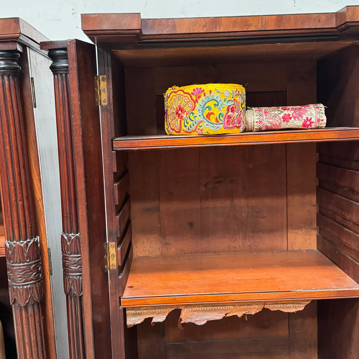 A Pair of Regency Mahogany Open Bookcases in the manner of George Bullock