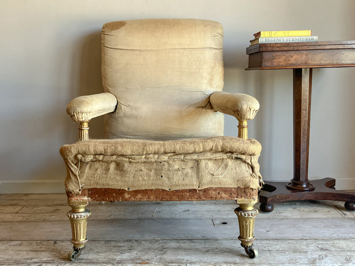 A Mid 19th Century Giltwood Open Armchair