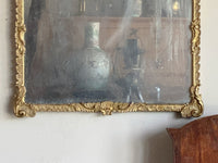 An Early 19th Century Rococo Revival Giltwood and Composition Mirror