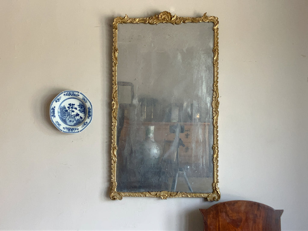 An Early 19th Century Rococo Revival Giltwood and Composition Mirror