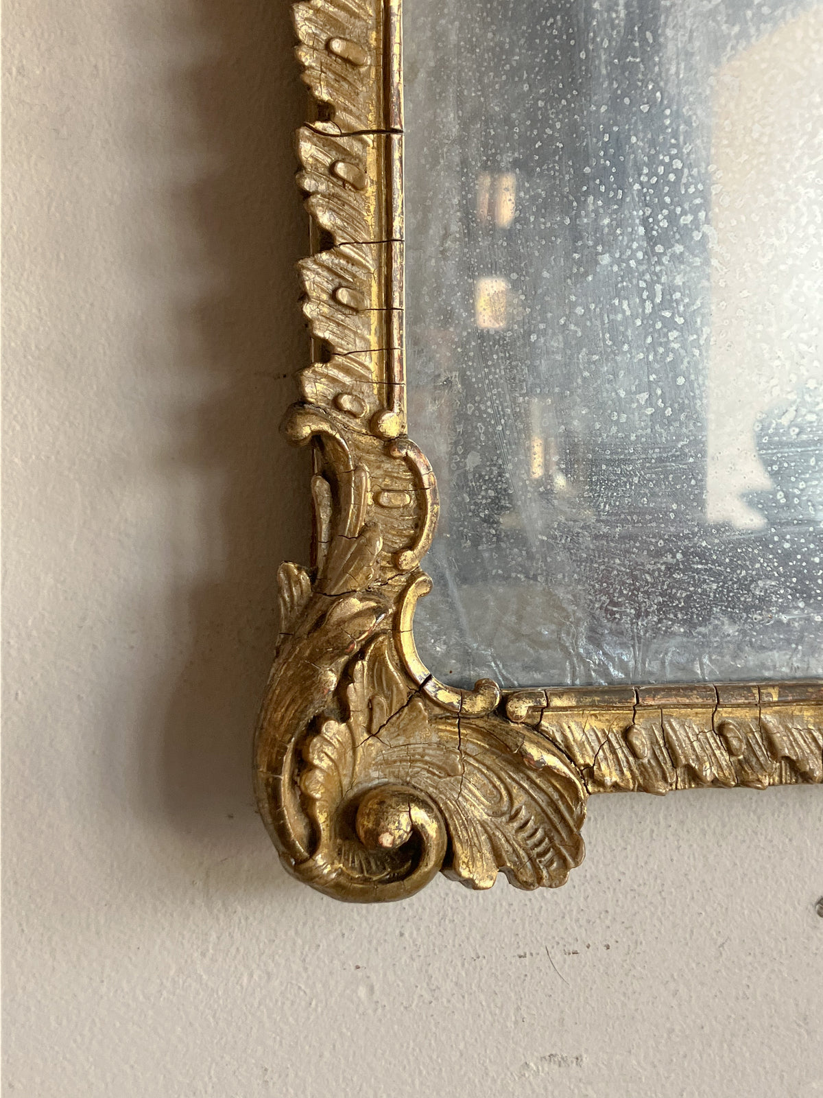 An Early 19th Century Rococo Revival Giltwood and Composition Mirror