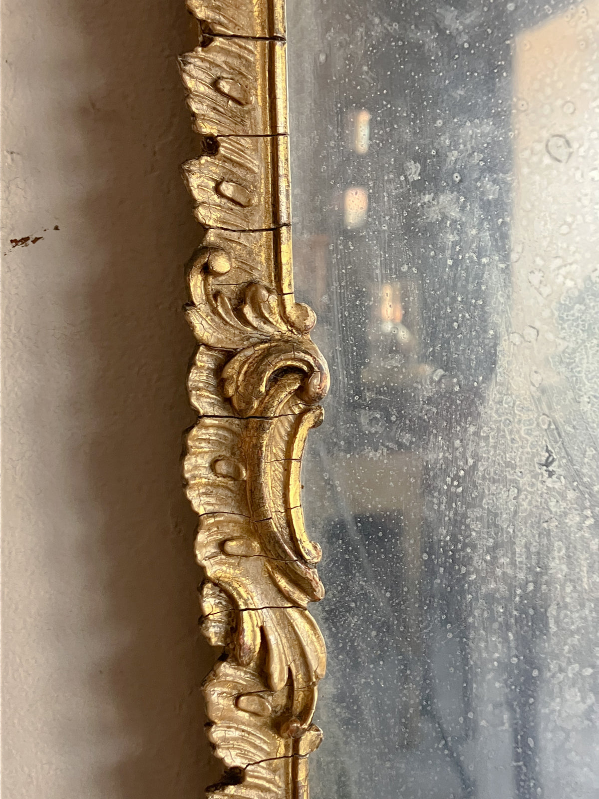 An Early 19th Century Rococo Revival Giltwood and Composition Mirror