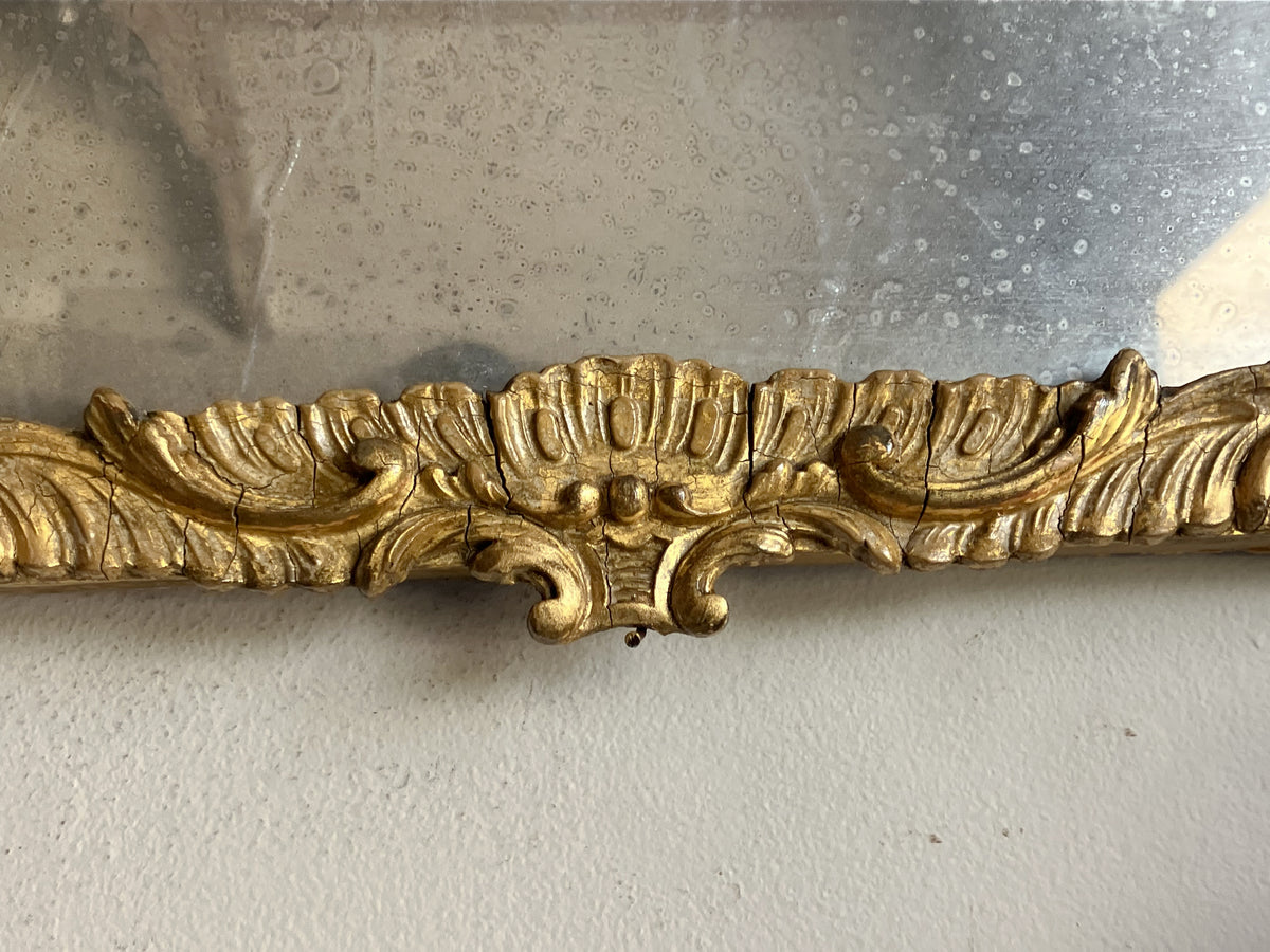 An Early 19th Century Rococo Revival Giltwood and Composition Mirror