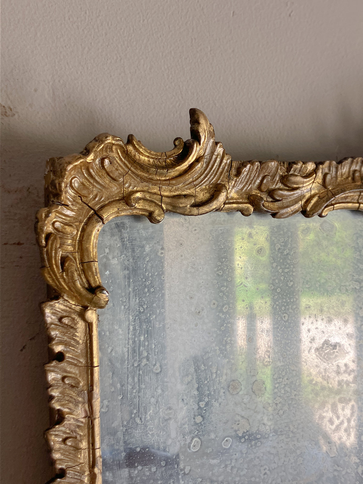 An Early 19th Century Rococo Revival Giltwood and Composition Mirror