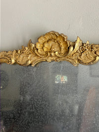 An Early 19th Century Rococo Revival Giltwood and Composition Mirror