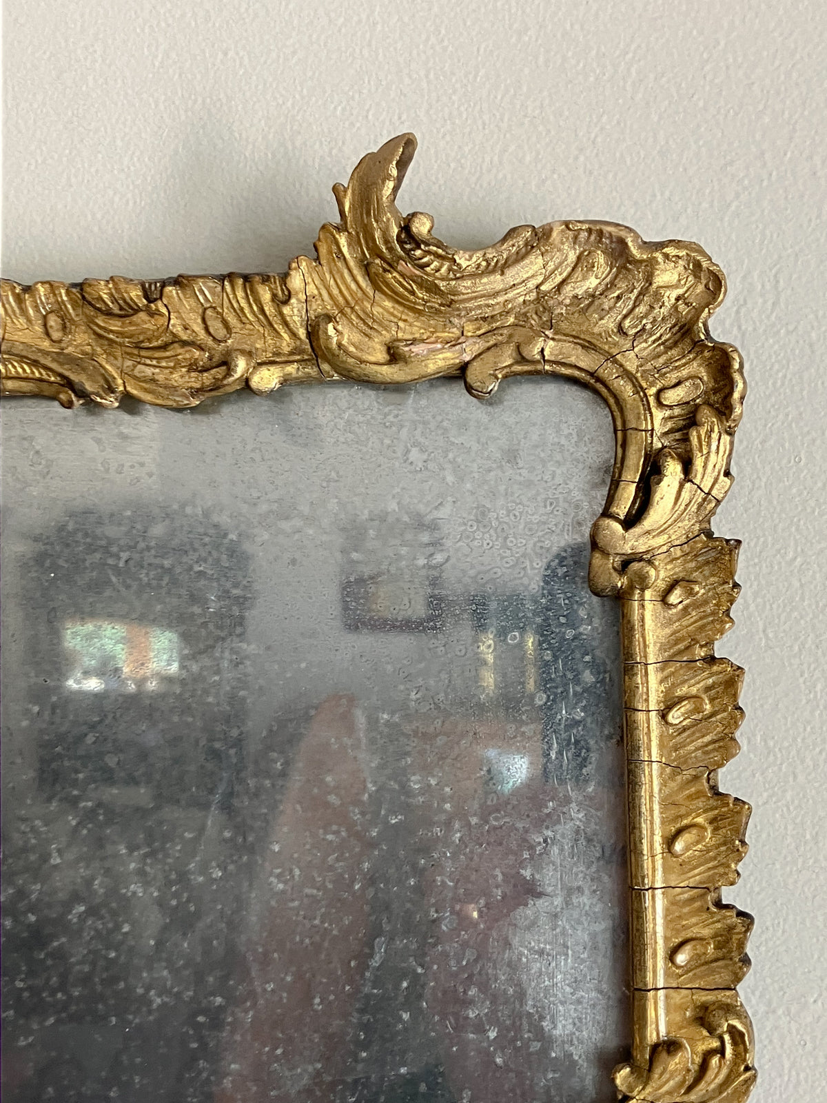 An Early 19th Century Rococo Revival Giltwood and Composition Mirror