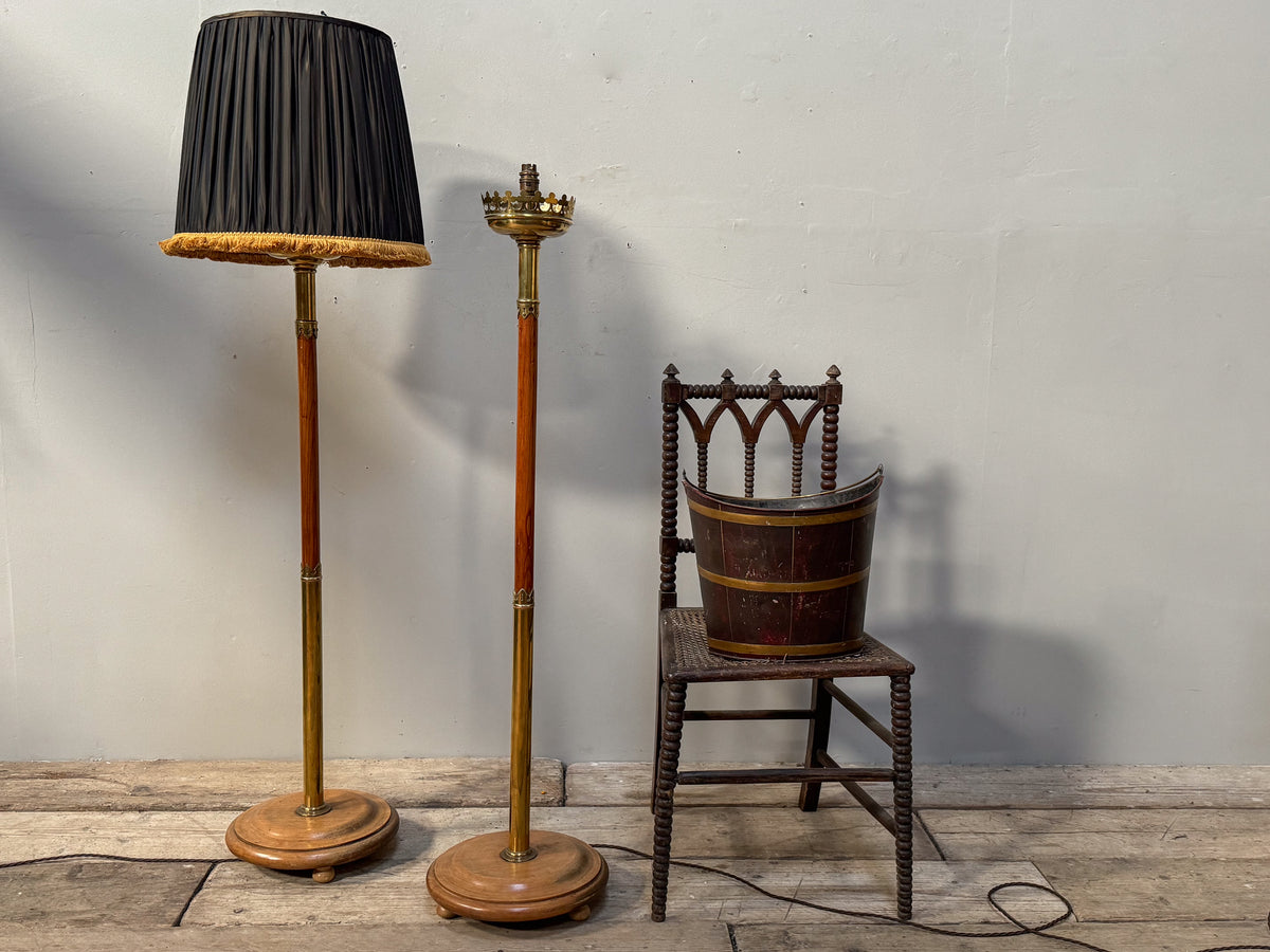 A Pair of Early 20th Century Brass and Oak Standard Lamps