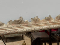 A George II and later Carved Pine Mirror