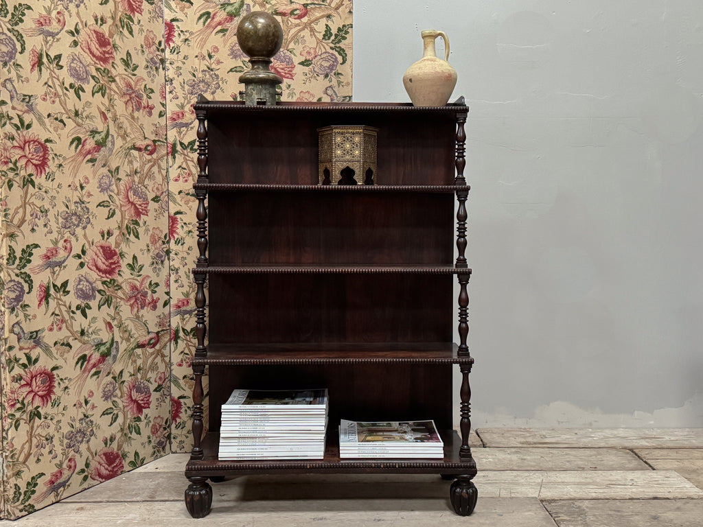 A Late Regency Rosewood Waterfall Bookcase