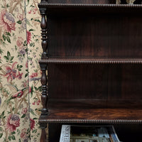 A Late Regency Rosewood Waterfall Bookcase