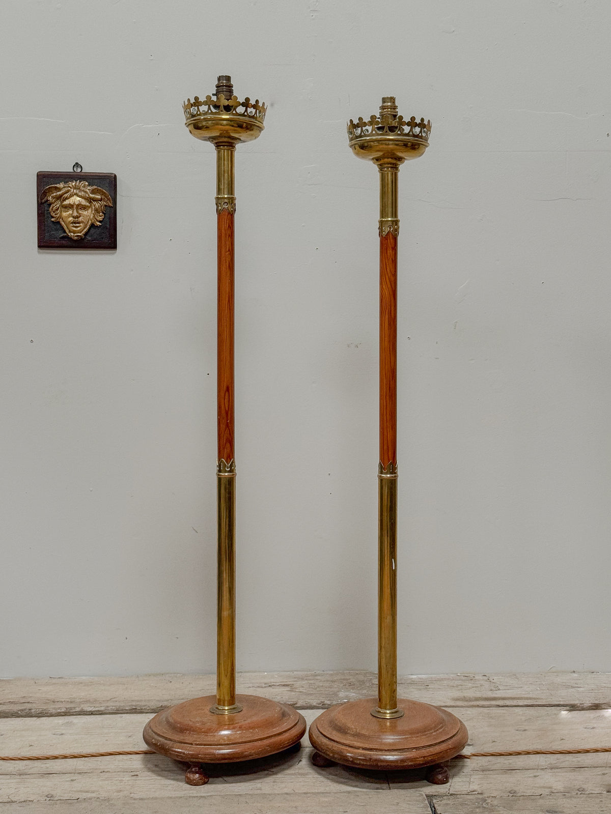 A Pair of Early 20th Century Brass and Oak Standard Lamps