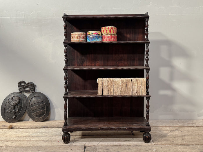 A Late Regency Rosewood Waterfall Bookcase