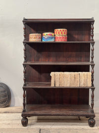 A Late Regency Rosewood Waterfall Bookcase