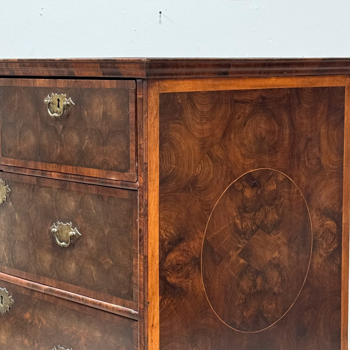 A William & Mary Oyster Veneered Chest of Drawers