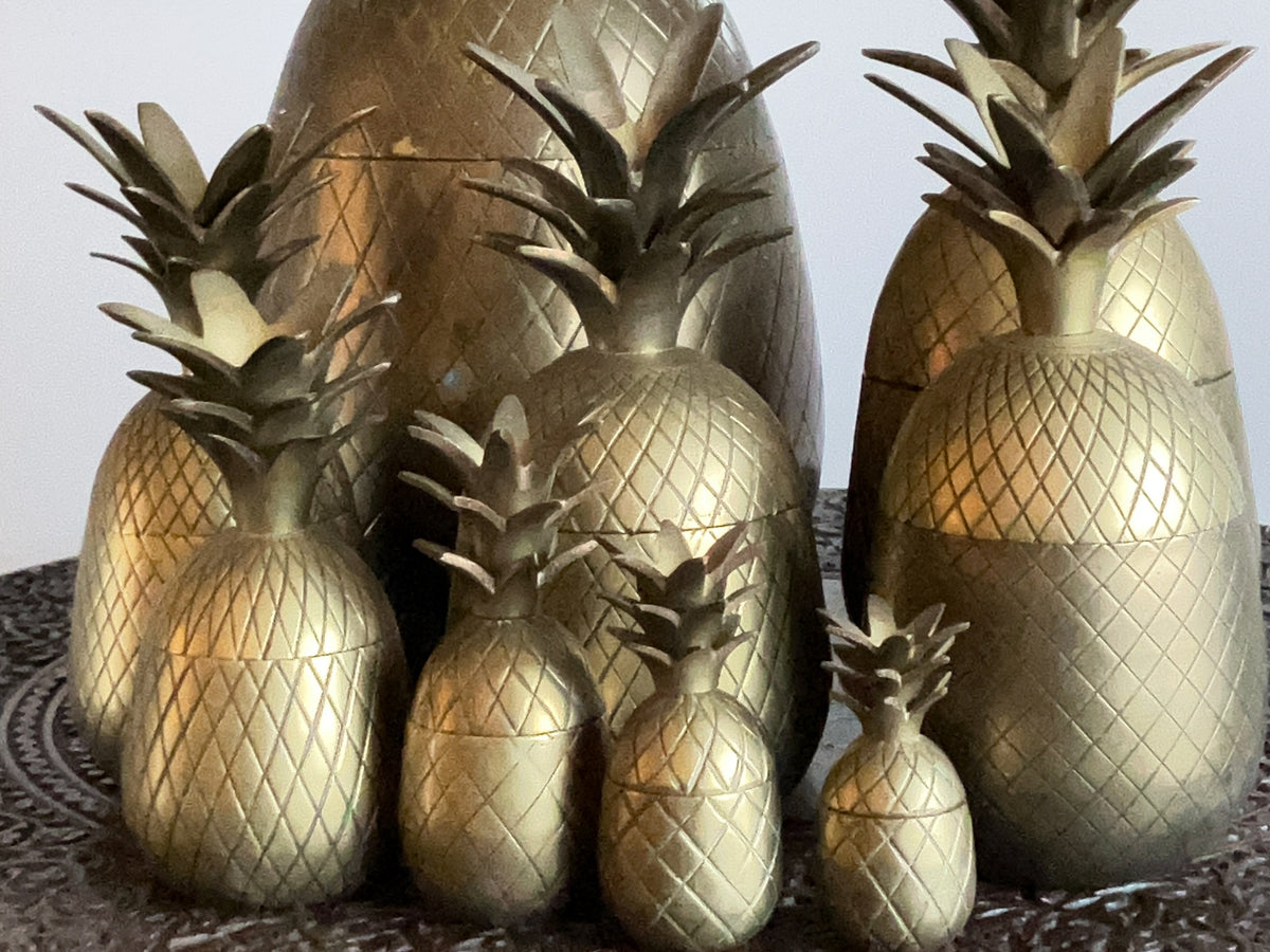 A Family of Mid Century Brass Pineapple Buckets