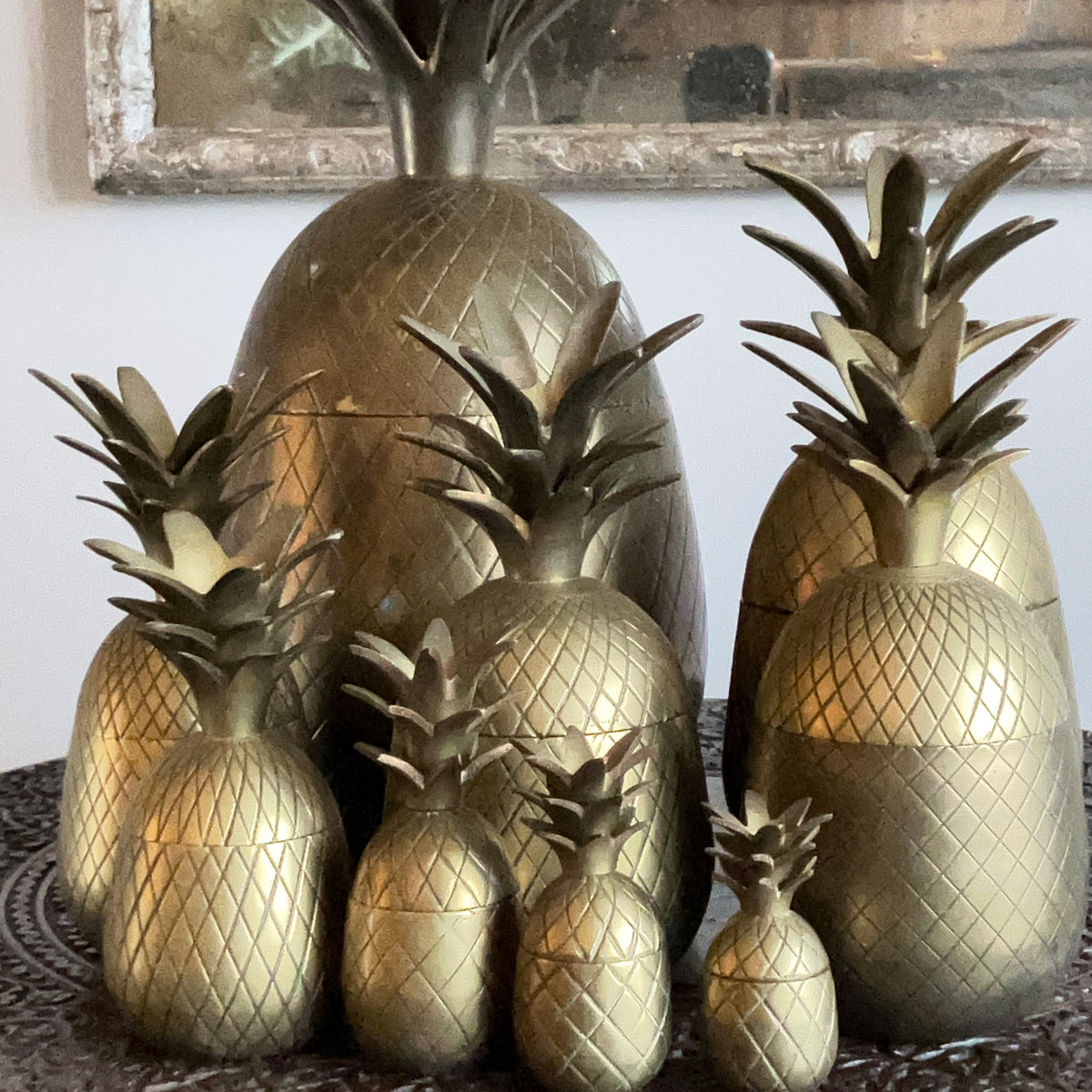 A Family of Mid Century Brass Pineapple Buckets