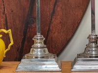 A Pair of Tall Silver Lamps