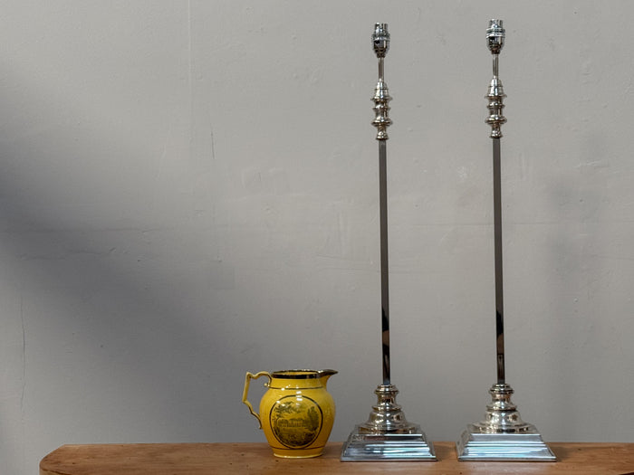 A Pair of Tall Silver Lamps