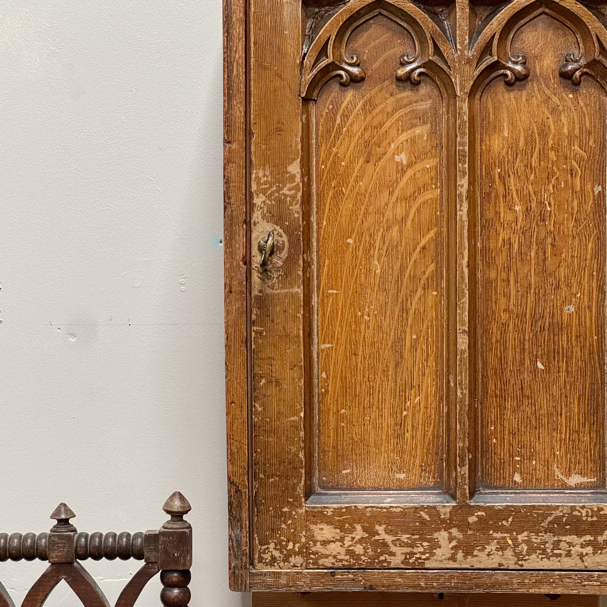 A Regency Pine Grain Painted Gothic Cupboard