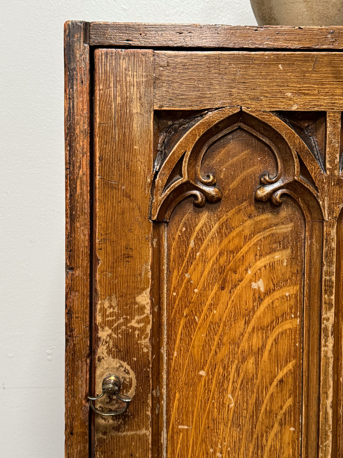 A Regency Pine Grain Painted Gothic Cupboard