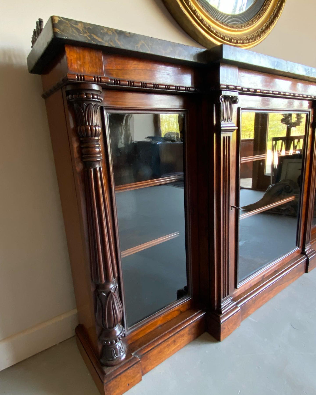 A Regency Rosewood Side Cabinet with Marble and Ormolu Top