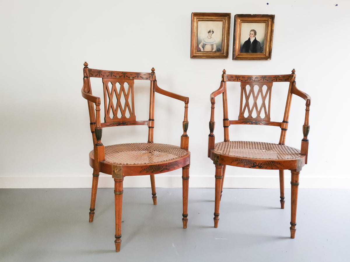 A Pair of Satinwood Elbow Chairs