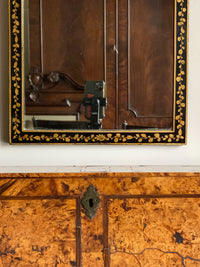 An Early 20th Century Ebonised and Gilt Mirror