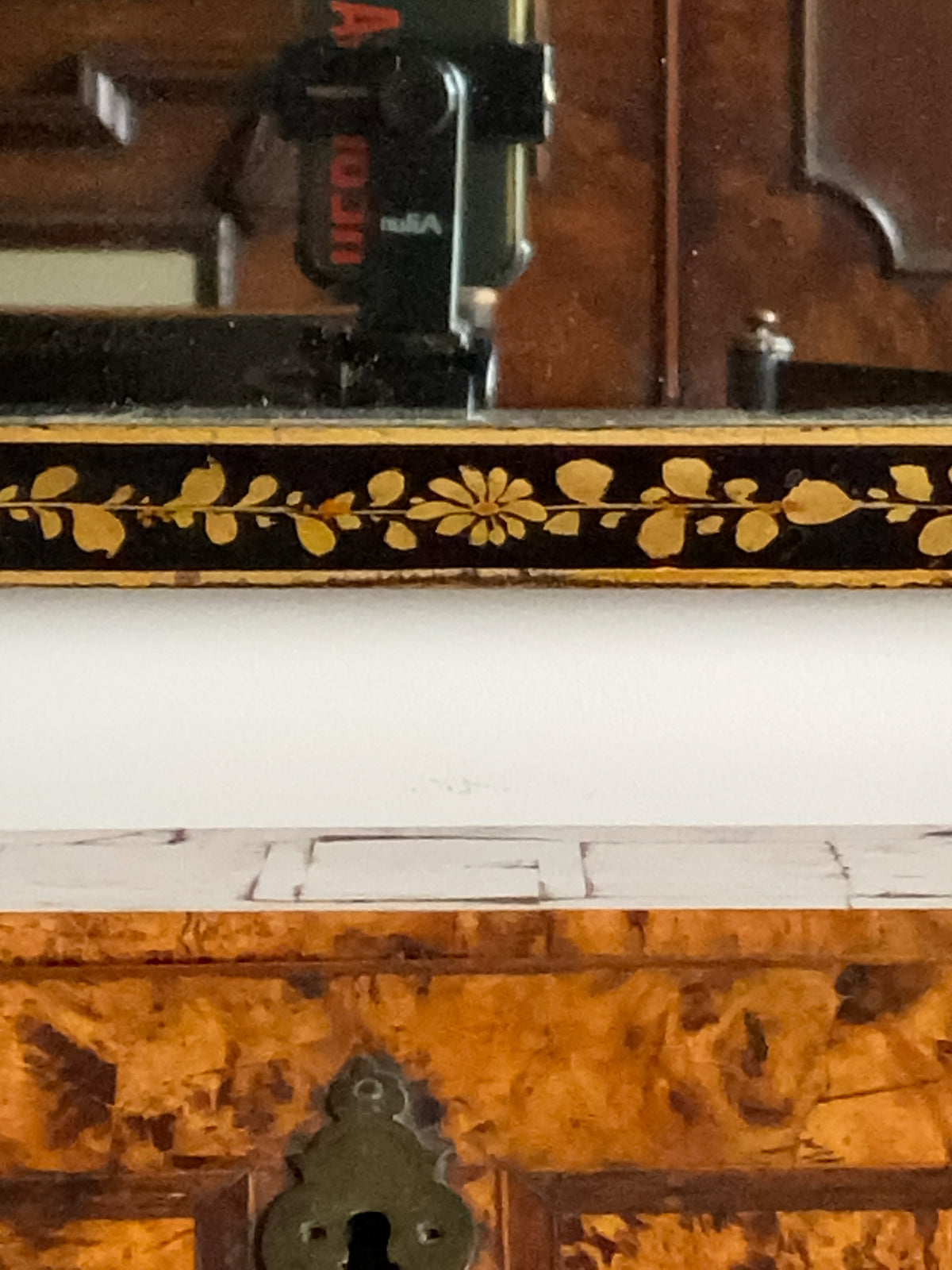 An Early 20th Century Ebonised and Gilt Mirror