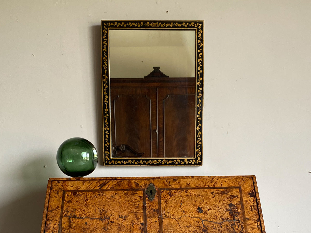 An Early 20th Century Ebonised and Gilt Mirror