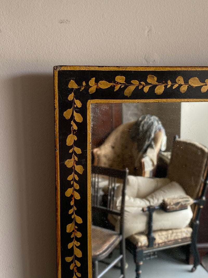 An Early 20th Century Ebonised and Gilt Mirror