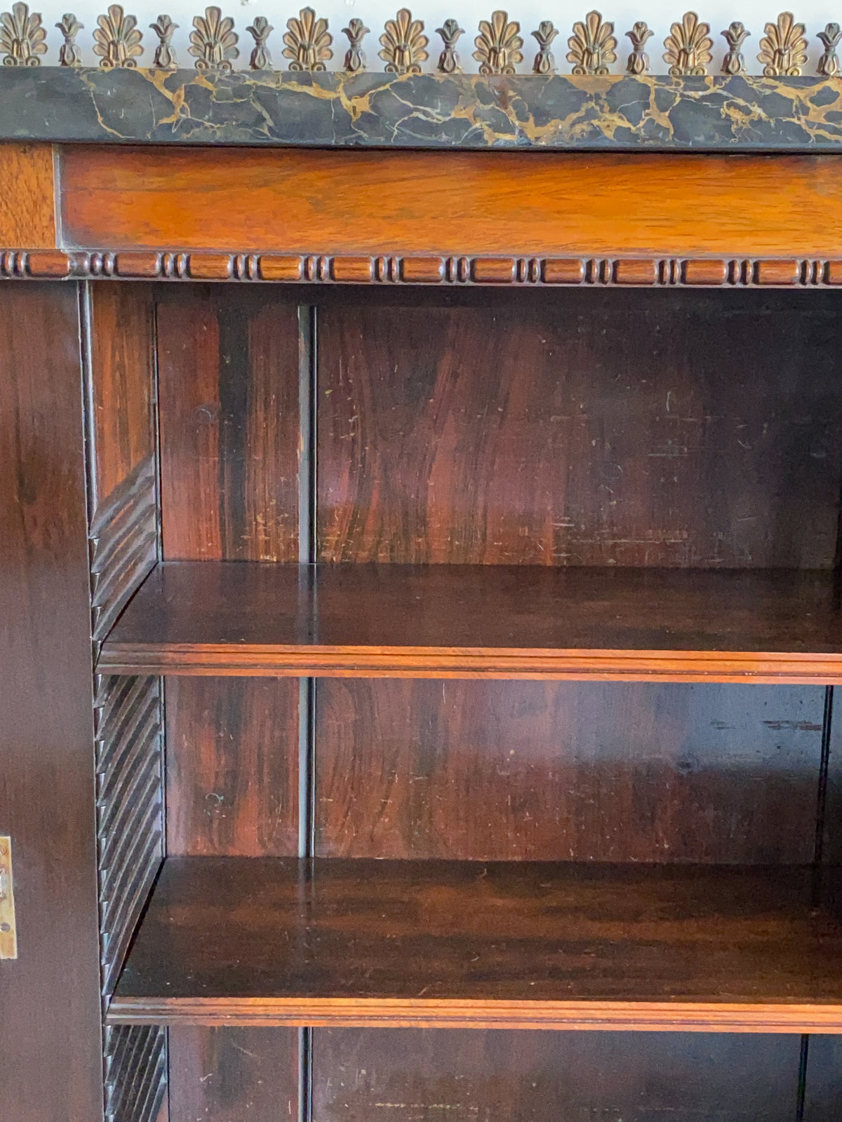 A Regency Rosewood Side Cabinet with Marble and Ormolu Top