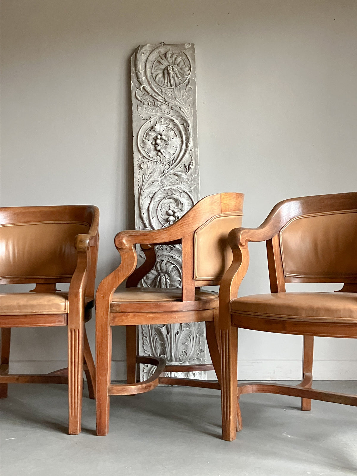 A Set of Twelve Early 20th Century Oak and Leather Dining Chairs