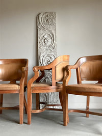 A Set of Twelve Early 20th Century Oak and Leather Dining Chairs