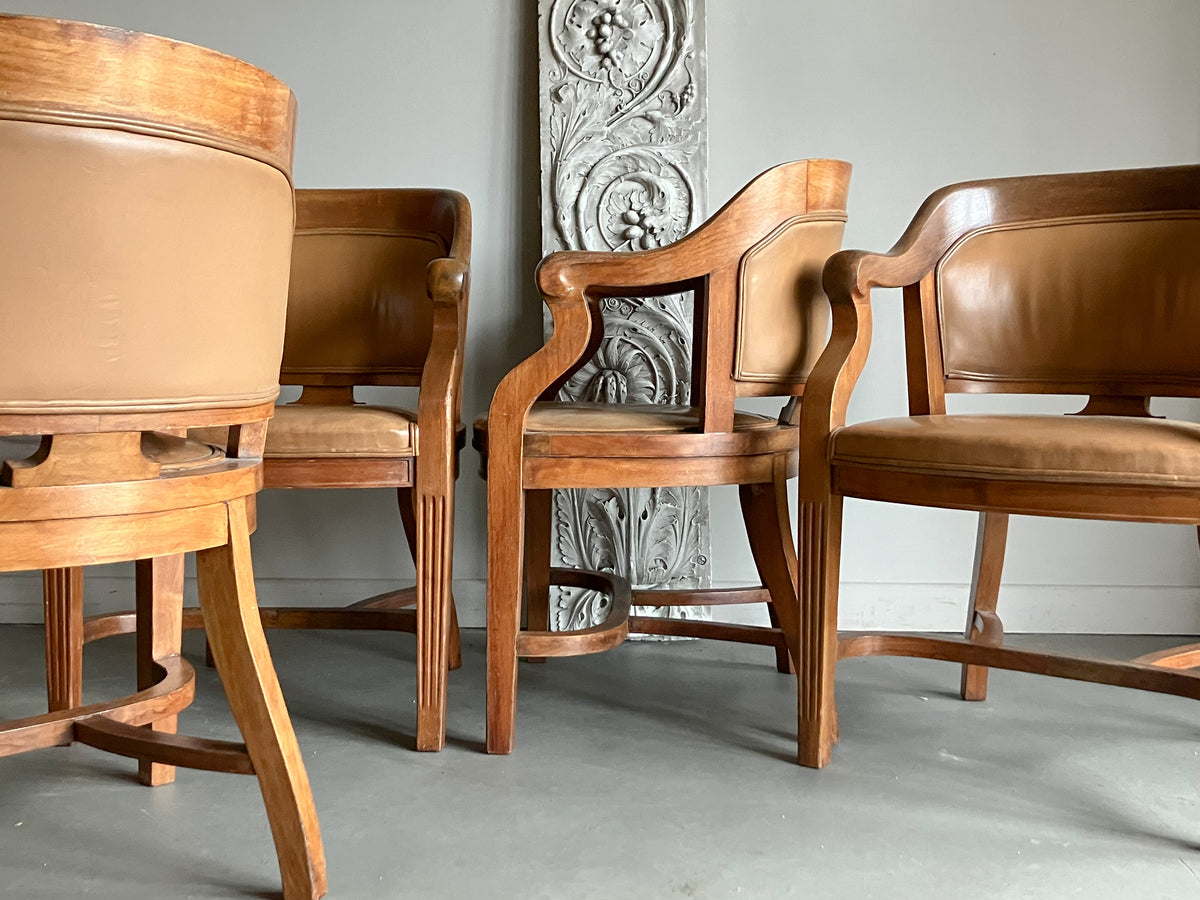 A Set of Twelve Early 20th Century Oak and Leather Dining Chairs