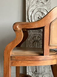 A Set of Twelve Early 20th Century Oak and Leather Dining Chairs