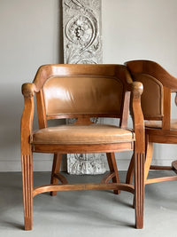 A Set of Twelve Early 20th Century Oak and Leather Dining Chairs