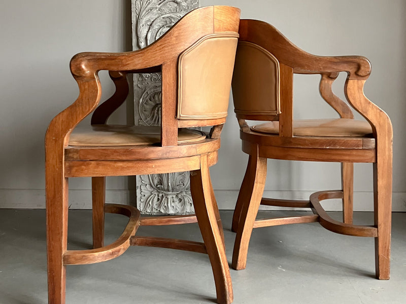 A Set of Twelve Early 20th Century Oak and Leather Dining Chairs