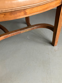 A Set of Twelve Early 20th Century Oak and Leather Dining Chairs