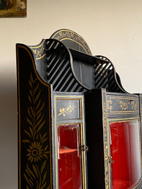 A Late Regency Ebonised and Gilt Side Cabinet