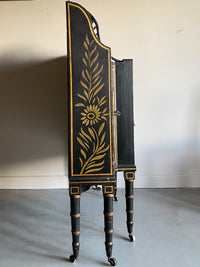 A Late Regency Ebonised and Gilt Side Cabinet