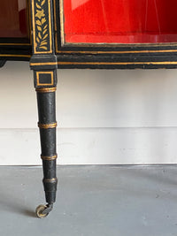 A Late Regency Ebonised and Gilt Side Cabinet