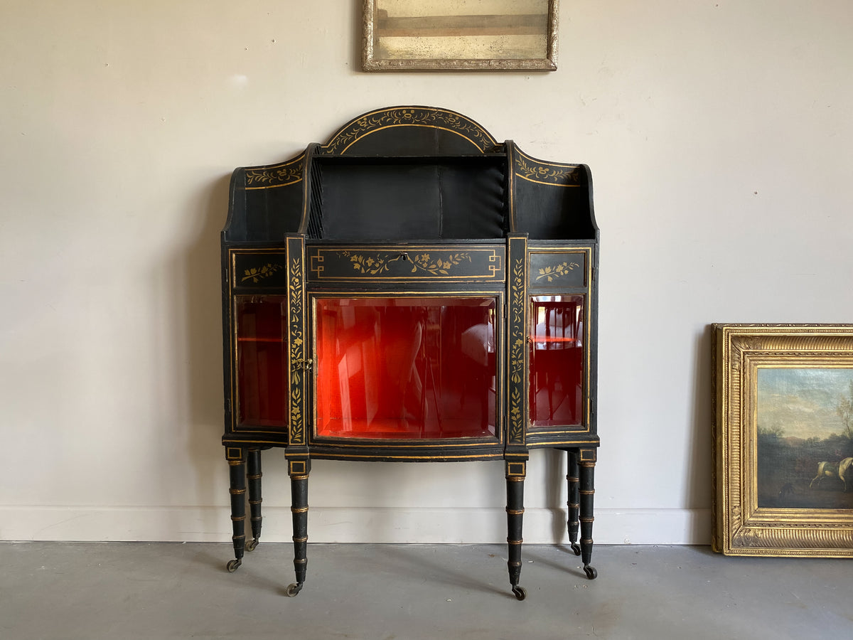 A Late Regency Ebonised and Gilt Side Cabinet